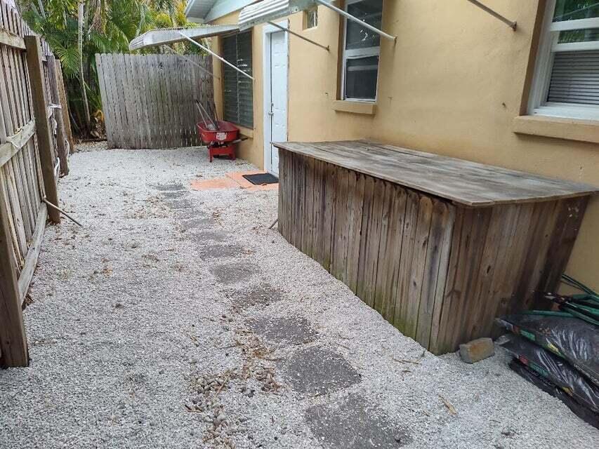 1951 Kathy Lane, Unit B Juno Ridge, FL 33408 - Photo 3 of 10 Side