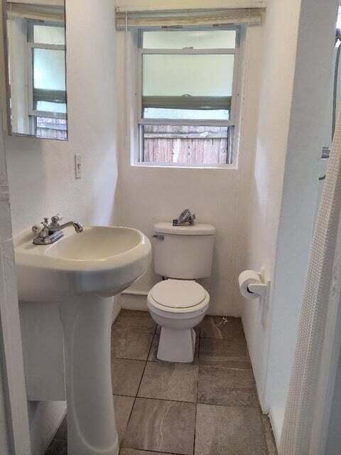 1951 Kathy Lane, Unit B Juno Ridge, FL 33408 - Photo 7 of 10 Bathroom