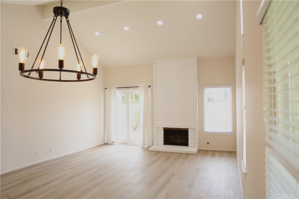 8462 Basin Circle Huntington Beach, CA 92646 - Photo 12 of 29 a view of a room with wooden floor and white wall