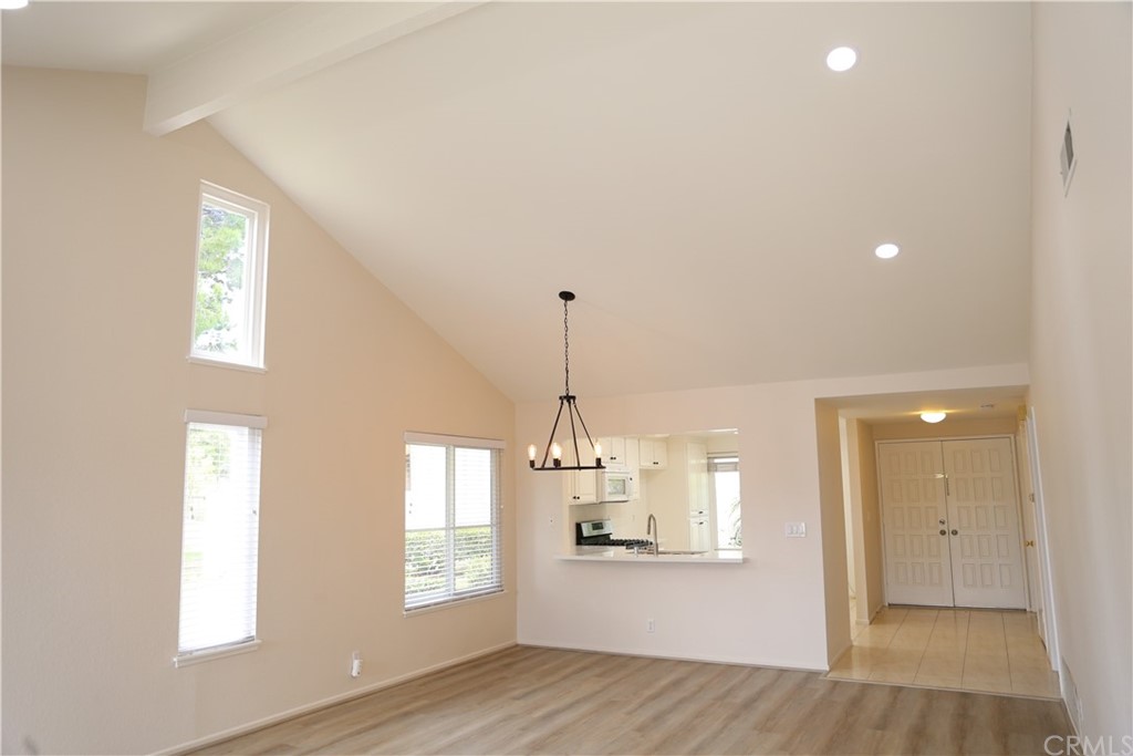 8462 Basin Circle Huntington Beach, CA 92646 - Photo 13 of 29 a view of a room with wooden floor and windows