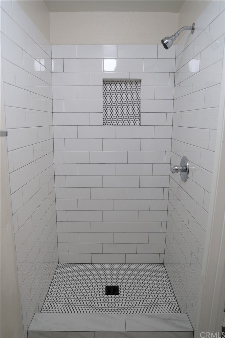 8462 Basin Circle Huntington Beach, CA 92646 - Photo 15 of 29 a bathroom with a shower