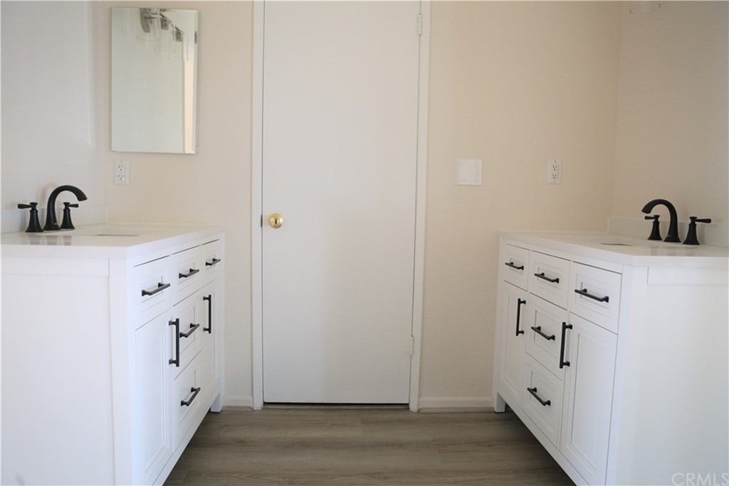 8462 Basin Circle Huntington Beach, CA 92646 - Photo 18 of 29 a view of cabinets with wooden floor