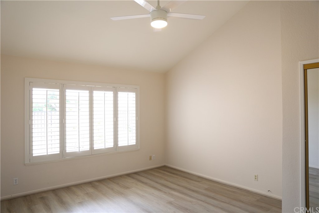 8462 Basin Circle Huntington Beach, CA 92646 - Photo 20 of 29 an empty room with wooden floor and windows
