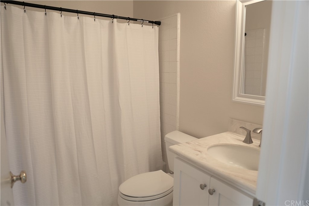 8462 Basin Circle Huntington Beach, CA 92646 - Photo 22 of 29 a bathroom with a sink and toilet