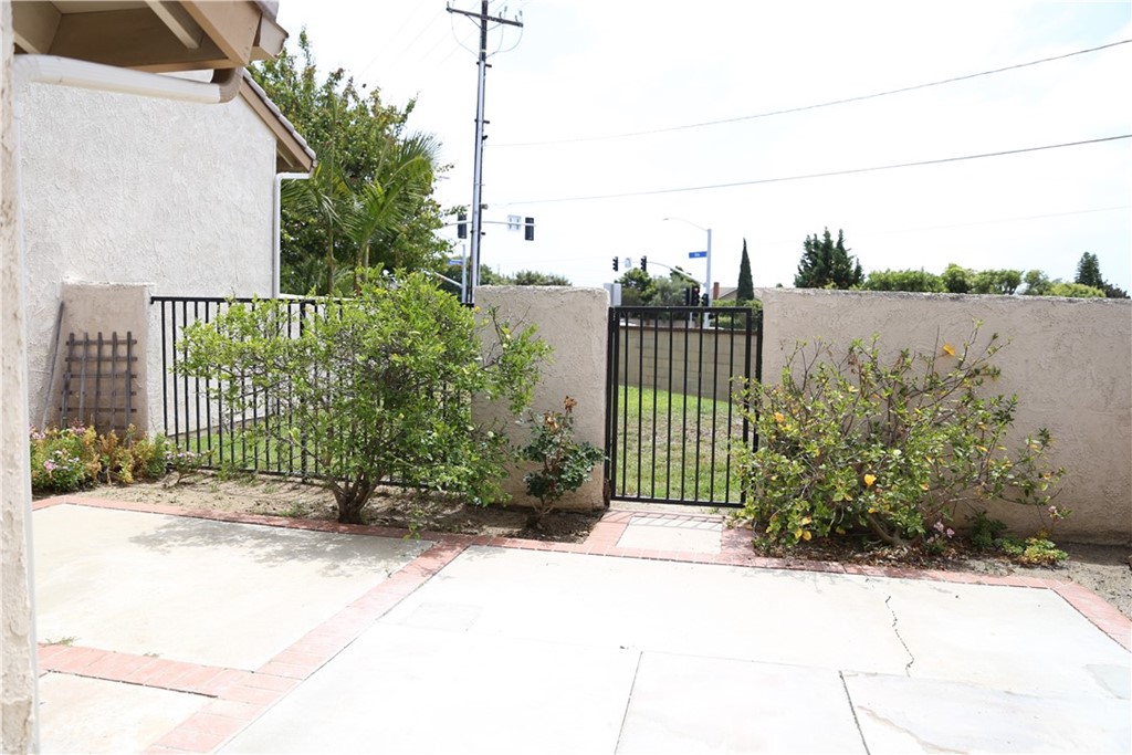 8462 Basin Circle Huntington Beach, CA 92646 - Photo 26 of 29 a view of a garden with a bench in the background