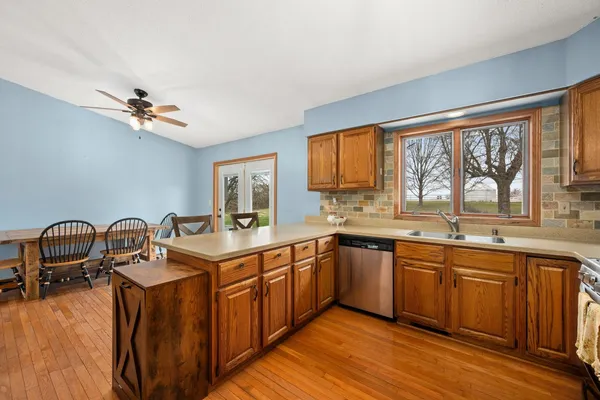 a kitchen with sink cabinets and appliances