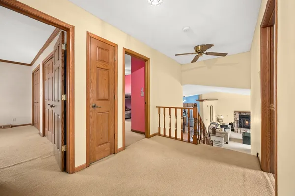 a view of a hallway with a living area