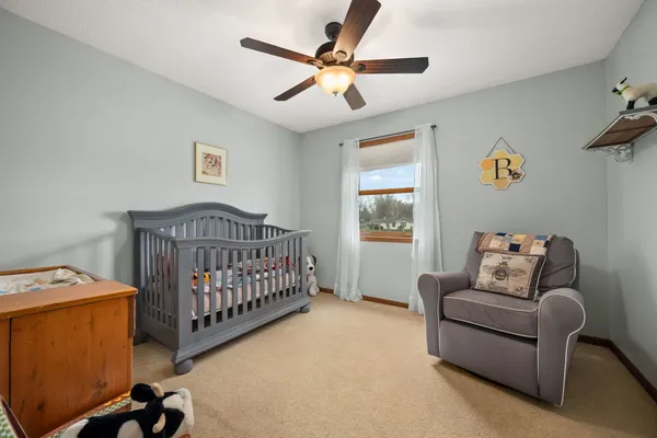 a bedroom with furniture and a window