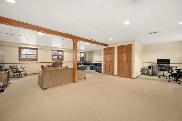 a large room with furniture and a large window