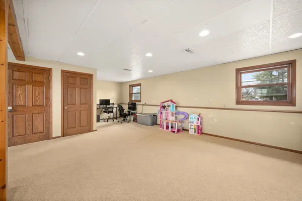 a view of a room with furniture and a window