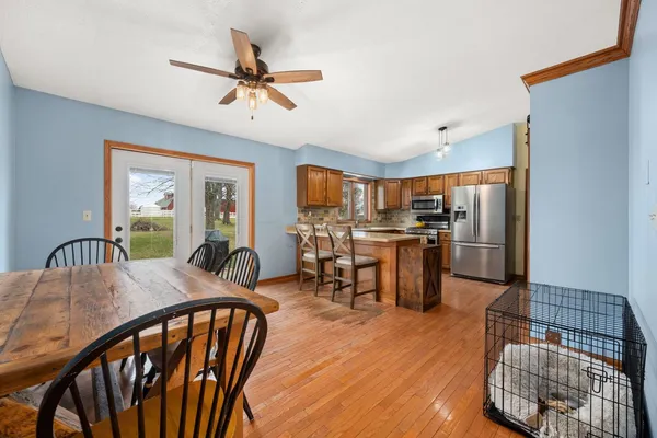 a view of a dining room with furniture window and wooden floor