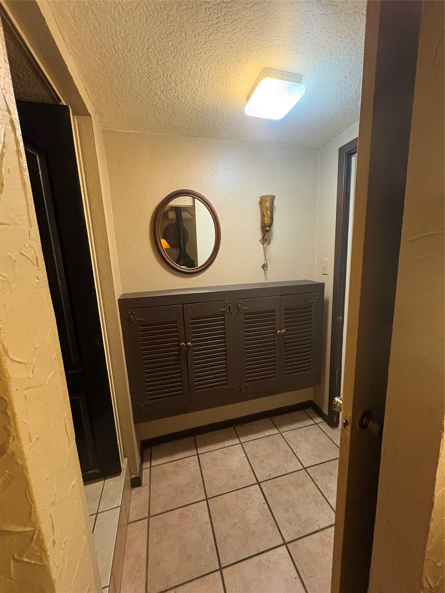 12505 Rollingwood Loop Conroe, TX 77303 - Photo 24 of 24 a bathroom with a sink a toilet and a mirror