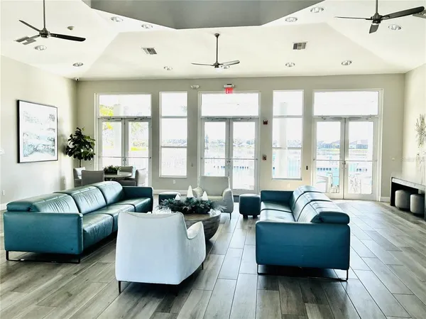 a living room with furniture and a large window