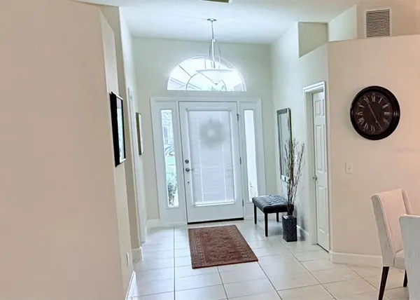 a view of a hallway with entryway door