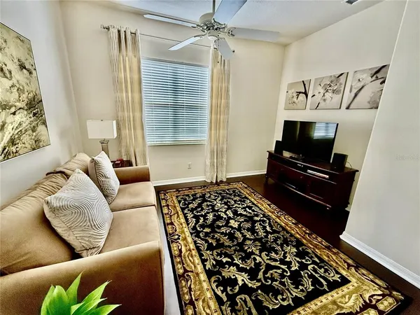 a living room with a couch and a flat screen tv