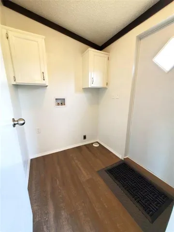 a view of a balcony with wooden floor