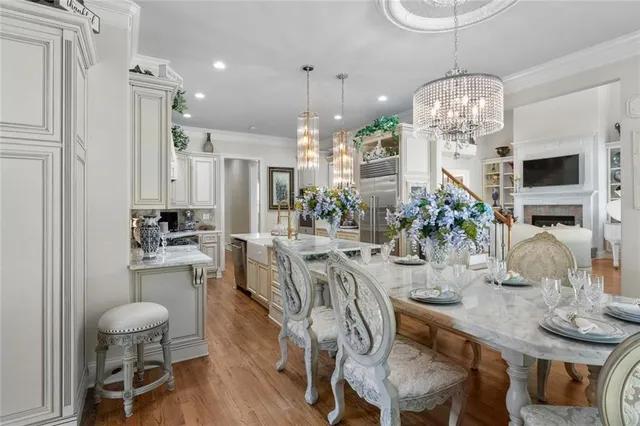 a view of a chairs and table in kitchen