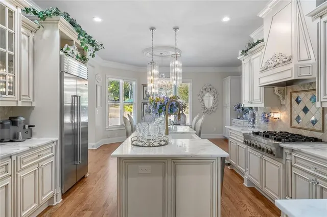 an aerial view of a house with a yard basket ball court and outdoor seating