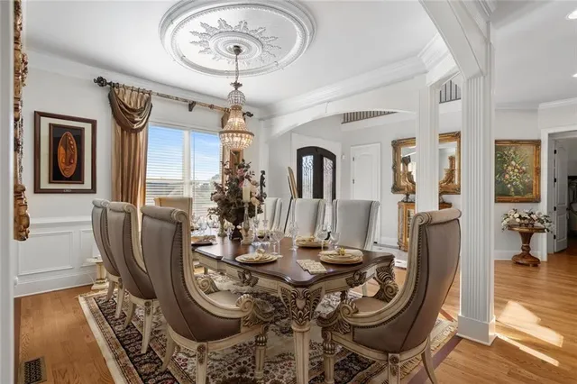 a view of a dining room with furniture and a table