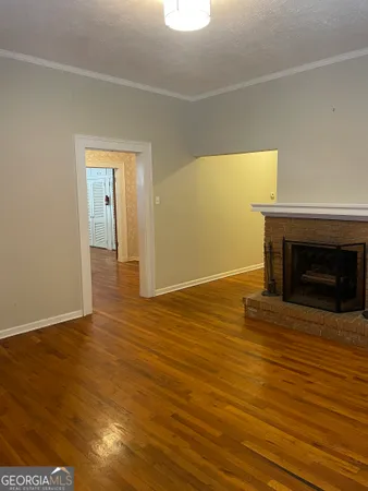 a view of a livingroom with wooden floor