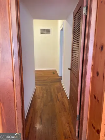 a spacious bedroom with a bed and a fireplace