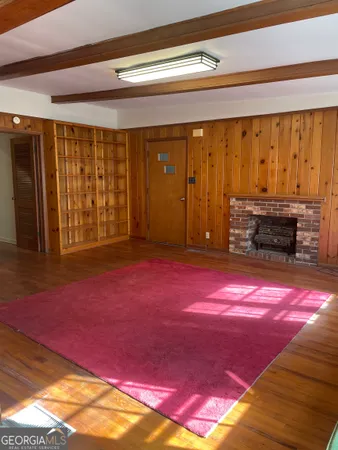 a view of a room that has a bed and a window