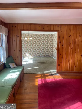 a view of a room with window wooden floor and a fireplace