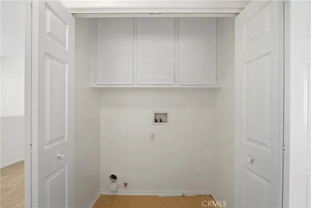 a bathroom with a white marble wall