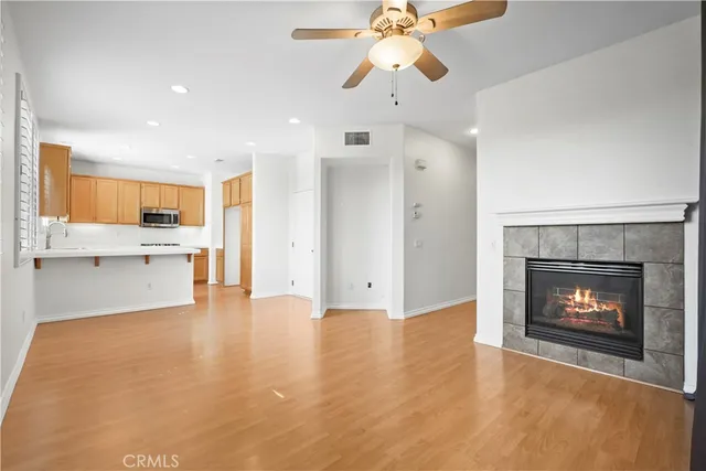 a view of an empty room with a fireplace