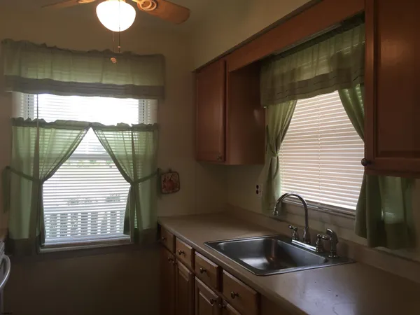 a kitchen that has a sink and a window
