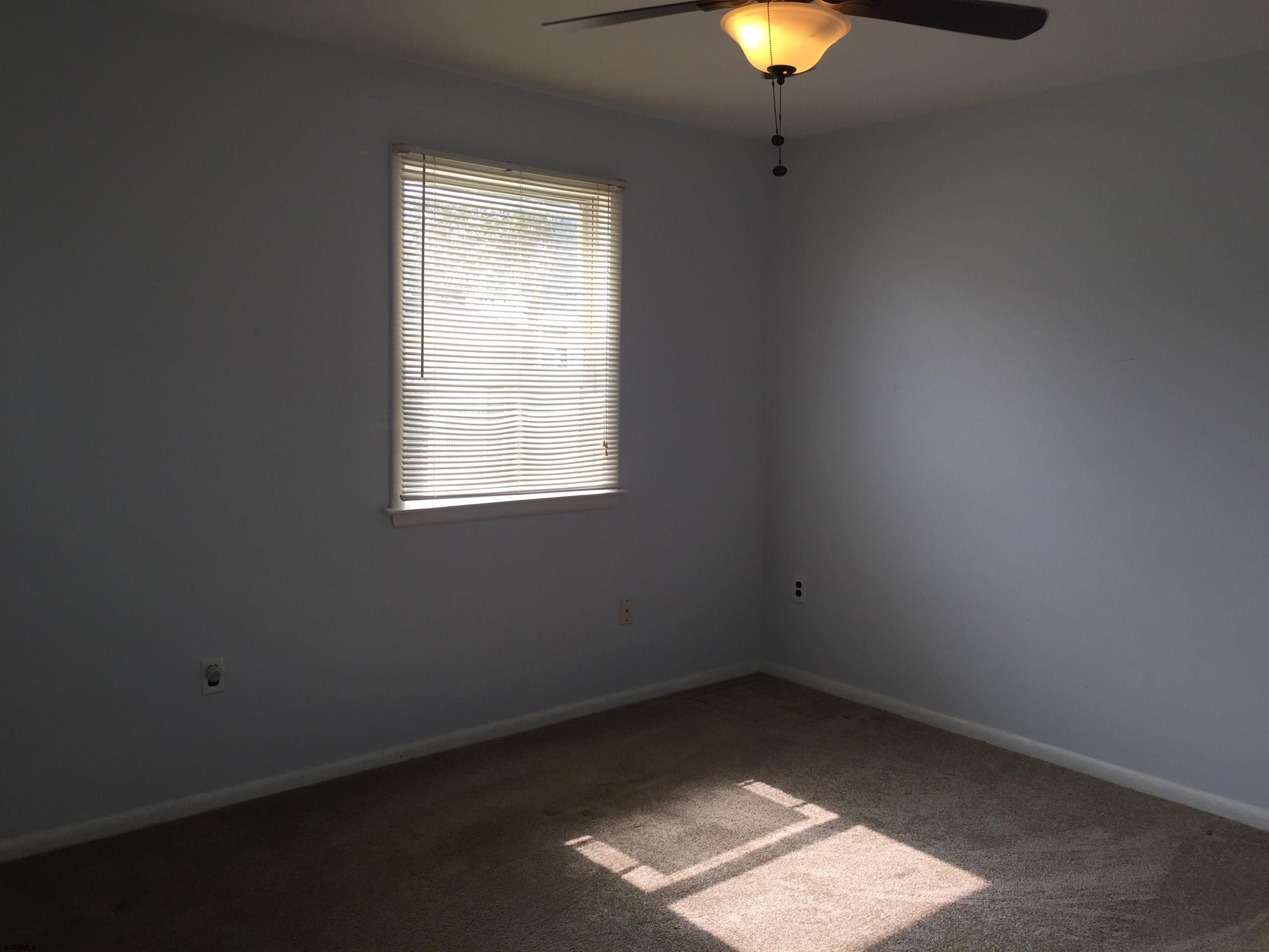 4632 Schooner Road, Unit 1 Brigantine, NJ 08203 - Photo 10 of 16 an empty room with a window