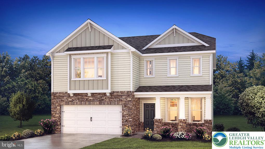 115 Winding Road Easton, PA 18040 - Photo 3 of 24 This newly constructed residence showcases a charming stone and siding facade with an attached garage.