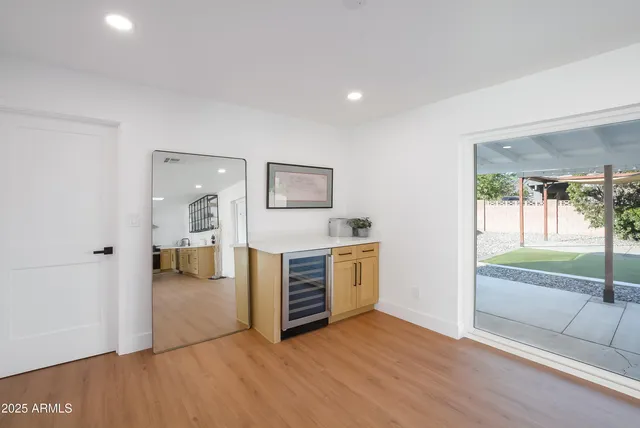 a kitchen with stainless steel appliances a stove sink and microwave