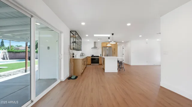 a view of a kitchen with wooden floor and a counter top space