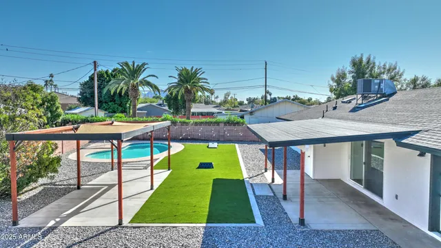 swimming pool view with a backyard space