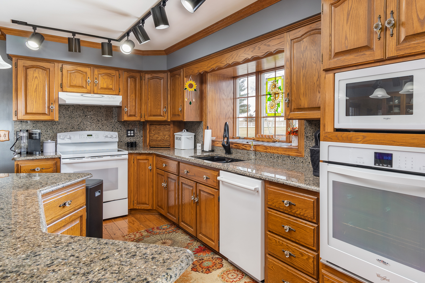 3508 East 5th Road LaSalle, IL 61301 - Photo 21 of 69 a kitchen with a stove a sink and a refrigerator