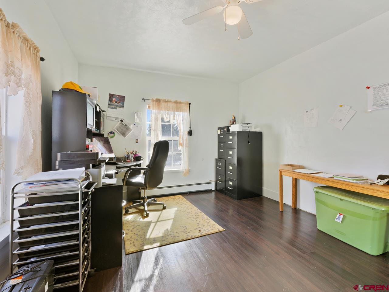 20809 Nowhere Road Eckert, CO 81418 - Photo 30 of 45 a view of a workspace with furniture and wooden floor