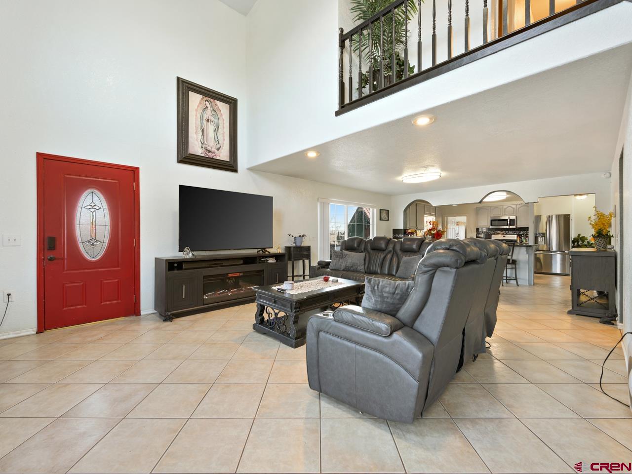 20809 Nowhere Road Eckert, CO 81418 - Photo 3 of 45 a living room with furniture and a flat screen tv