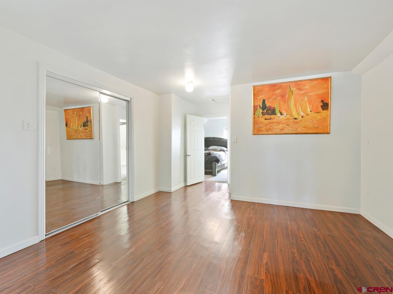 20809 Nowhere Road Eckert, CO 81418 - Photo 36 of 45 a view of empty room with wooden floor