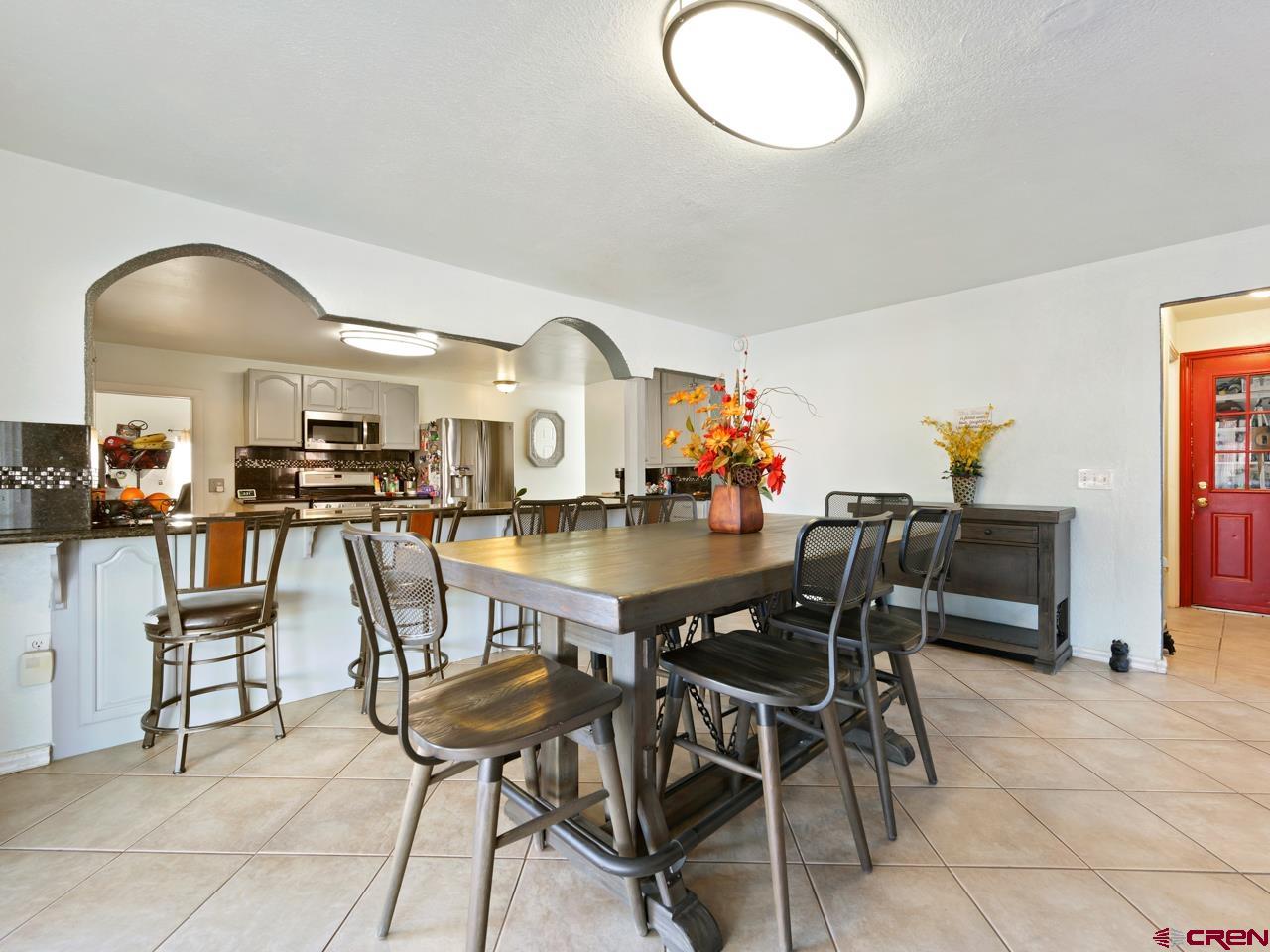 20809 Nowhere Road Eckert, CO 81418 - Photo 6 of 45 a view of a dining room with furniture and a chandelier