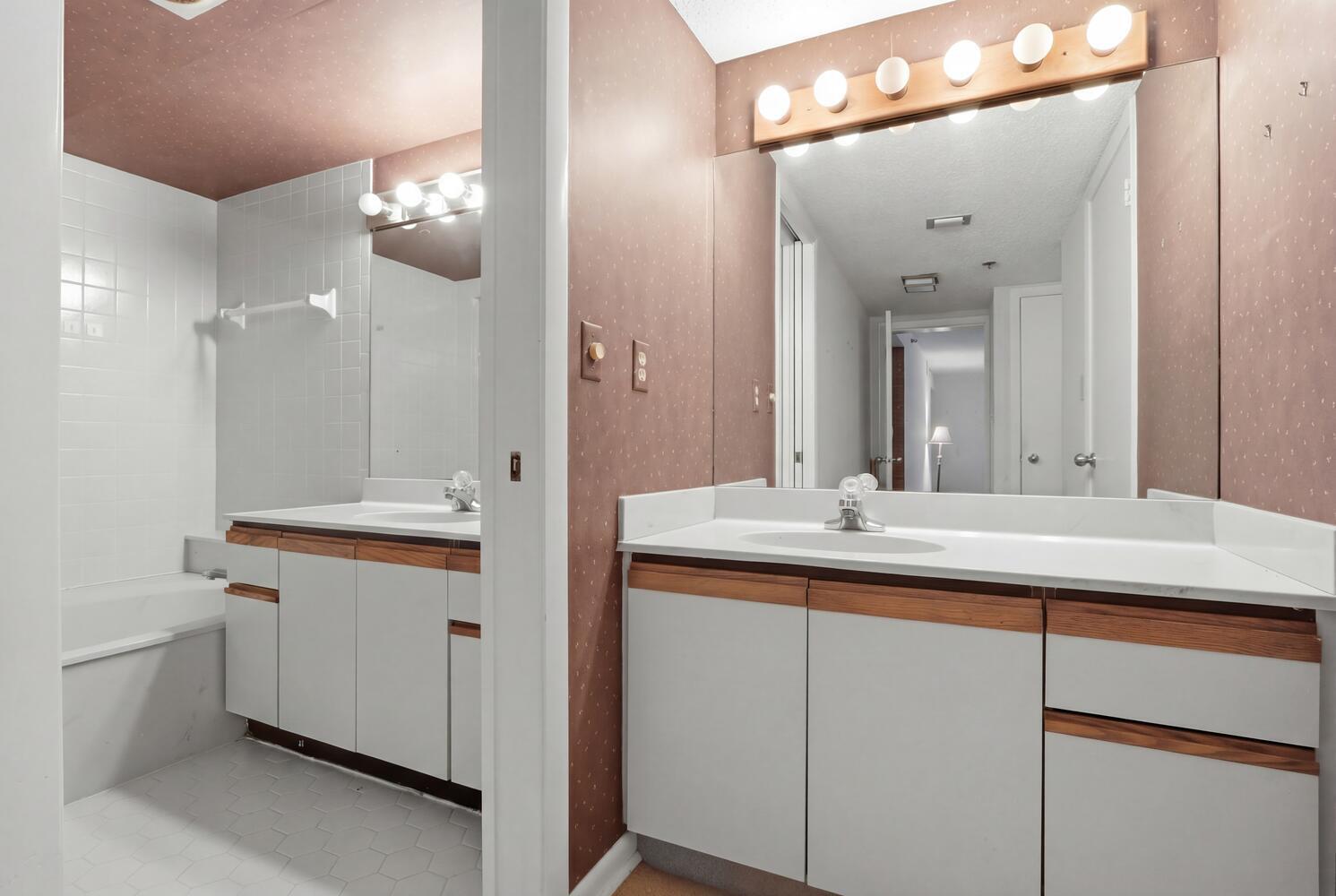 500 Ocean Trail Way, Unit 111 Jupiter, FL 33477 - Photo 15 of 35 a bathroom with a sink double vanity and a mirror