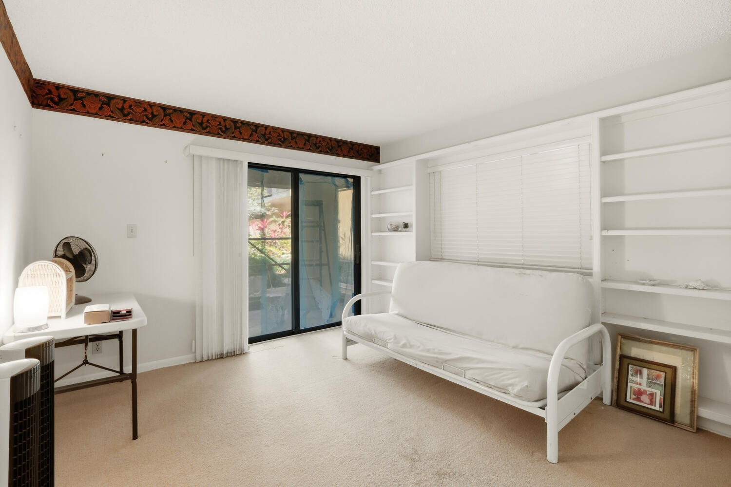 500 Ocean Trail Way, Unit 111 Jupiter, FL 33477 - Photo 16 of 35 a spacious bedroom with a bed and a table in it