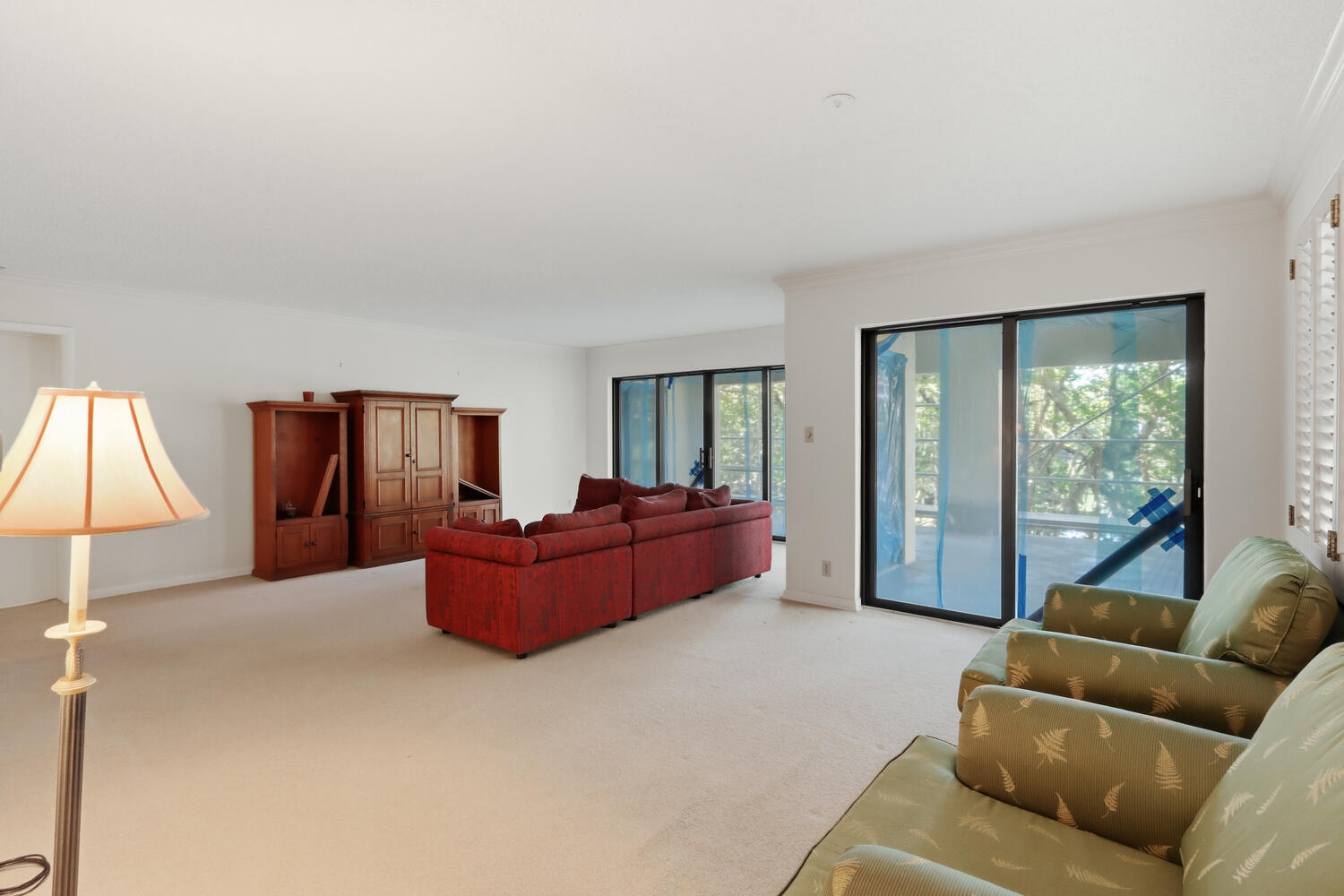 500 Ocean Trail Way, Unit 111 Jupiter, FL 33477 - Photo 6 of 35 a living room with furniture and a large window