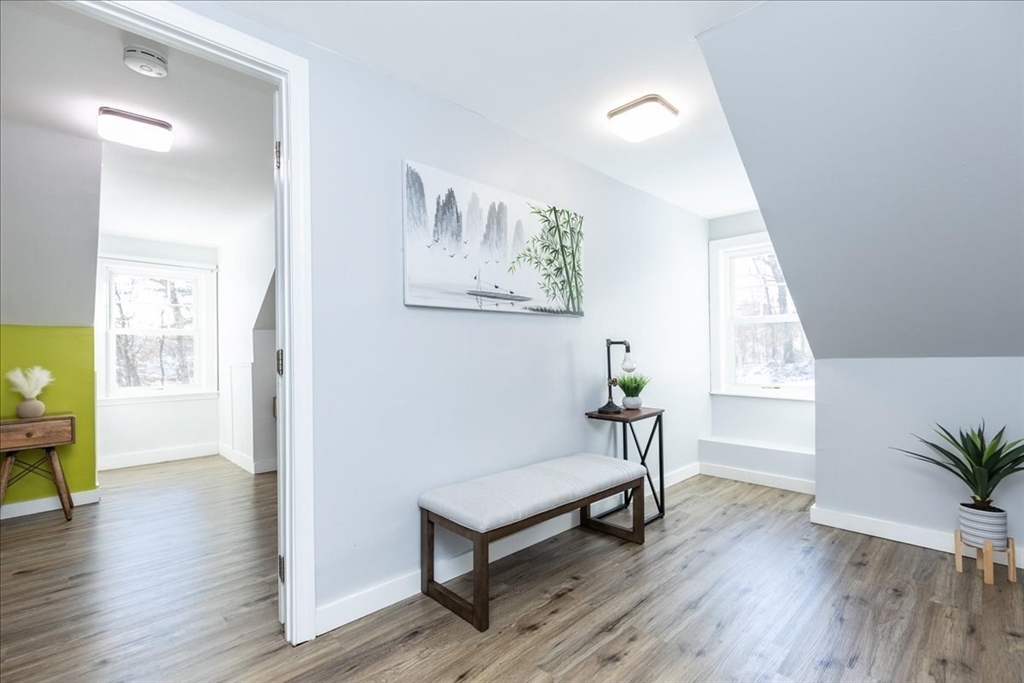 2 Summer Street North Reading, MA 01864 - Photo 24 of 42 a view of a hallway with wooden floor and a potted plant