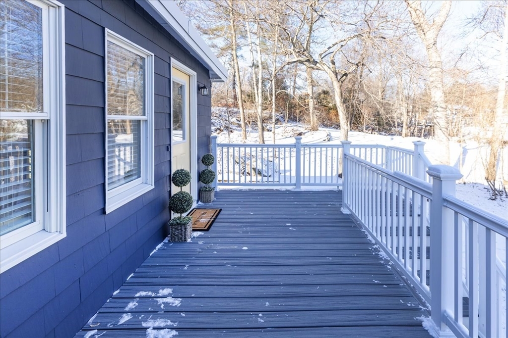 2 Summer Street North Reading, MA 01864 - Photo 30 of 42 a view of a deck with wooden floor and bench with wooden floor