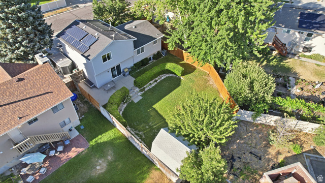 734 Sandy Dunes Drive Sandy, UT 84094 - Photo 34 of 36 Aerial perspective showcasing the property's exterior and expansive backyard