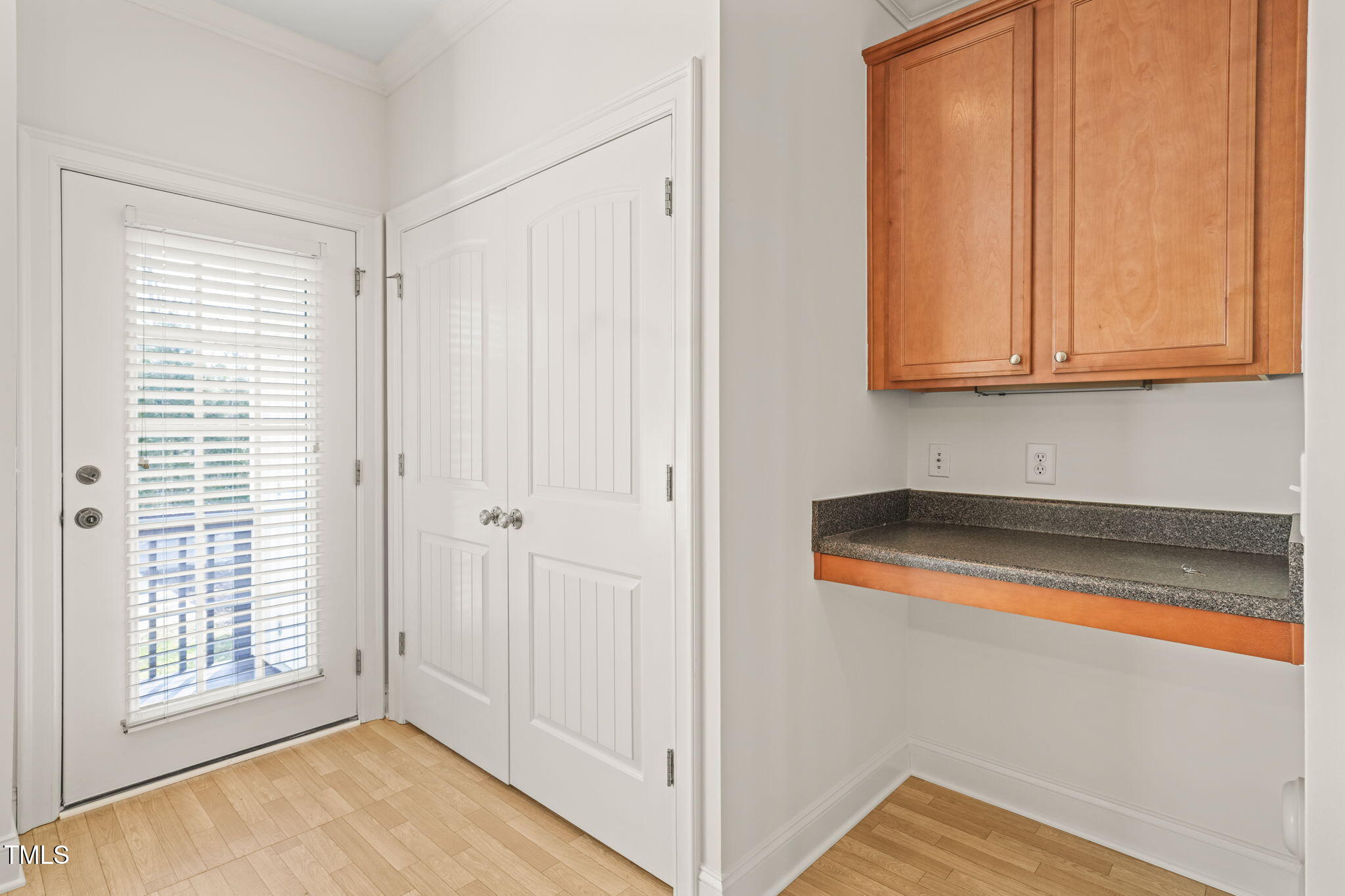7732 ACC Boulevard Raleigh, NC 27617 - Photo 11 of 32 a view of a room with wooden floor and cabinet