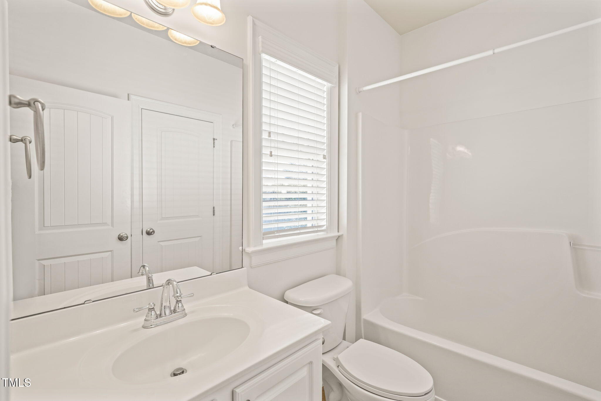 7732 ACC Boulevard Raleigh, NC 27617 - Photo 23 of 32 a bathroom with a sink toilet and shower
