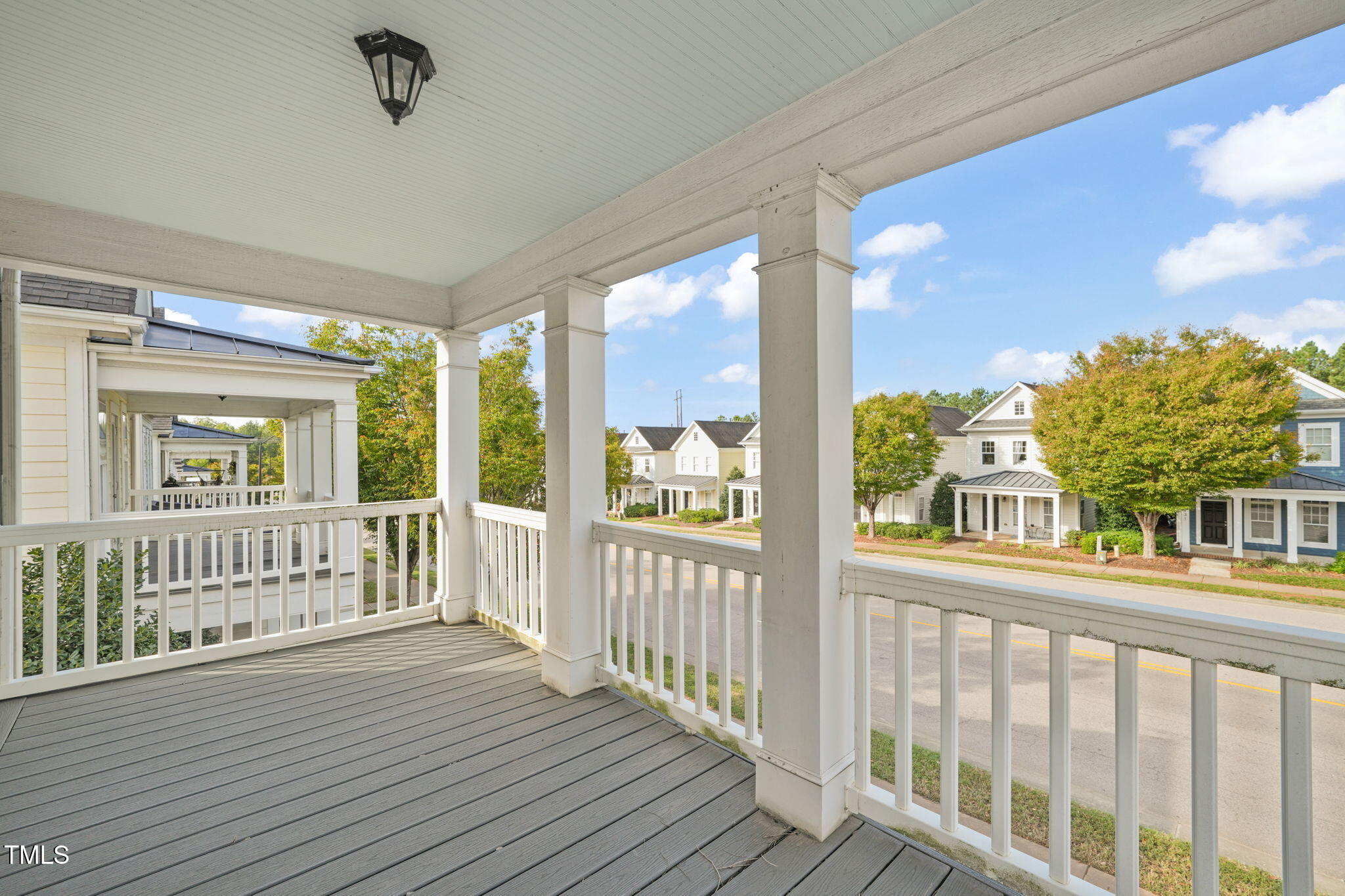 7732 ACC Boulevard Raleigh, NC 27617 - Photo 3 of 32 a view of a porch with wooden floor and outdoor space