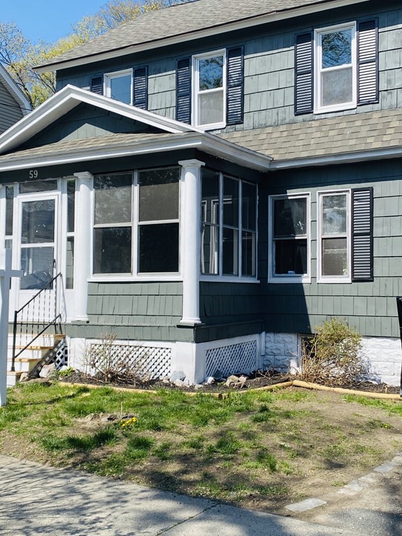 a front view of a house with a yard